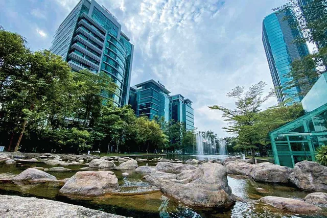 Office towers around the park and lake in Bangsar South