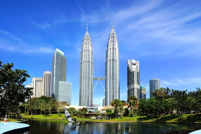 The Petronas Twin Towers seen across the lake in KLCC Park on a clear day