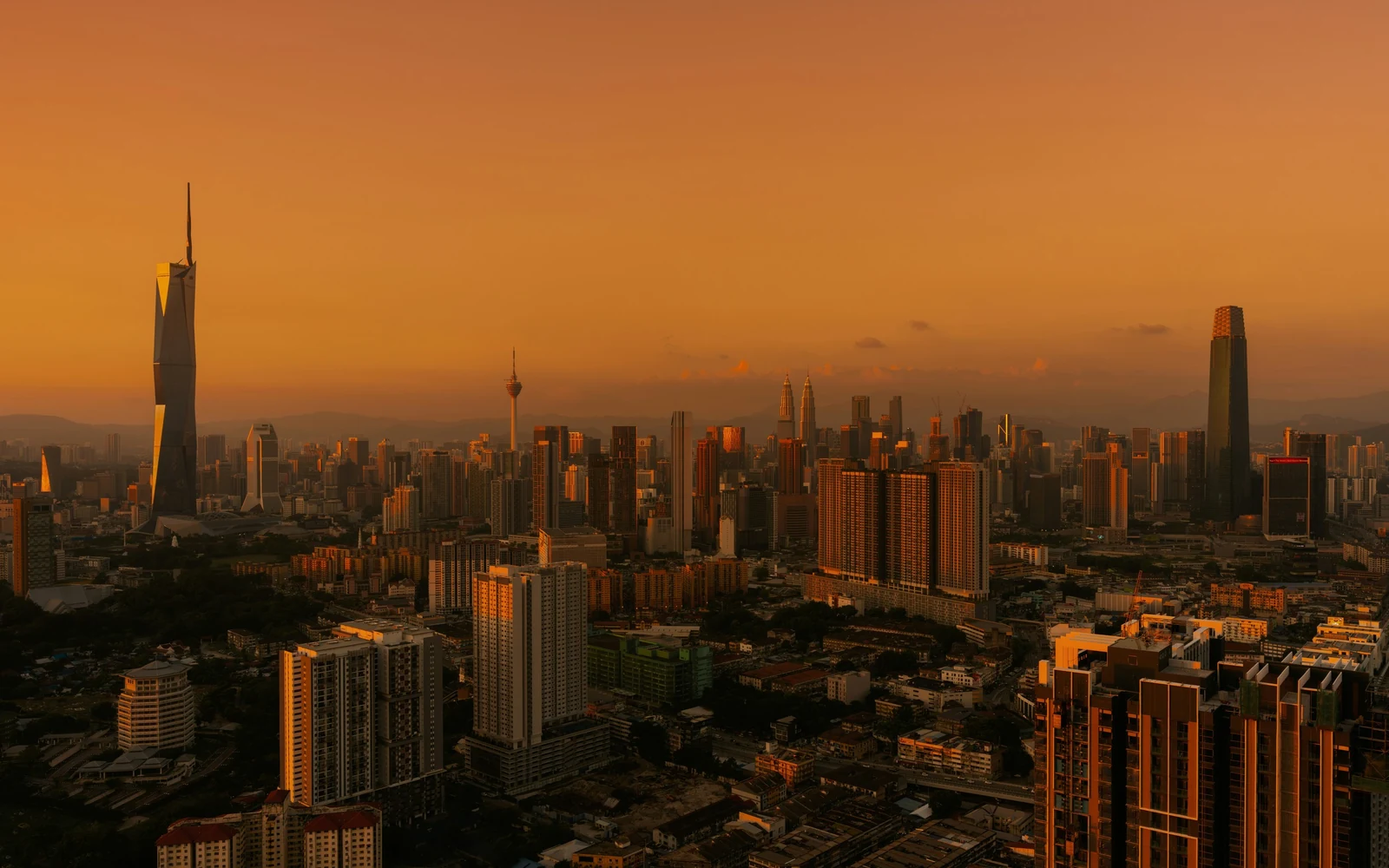 Kuala Lumpur city centre skyline at sunset, with Merdeka 118, KL Tower and The Exchange 106