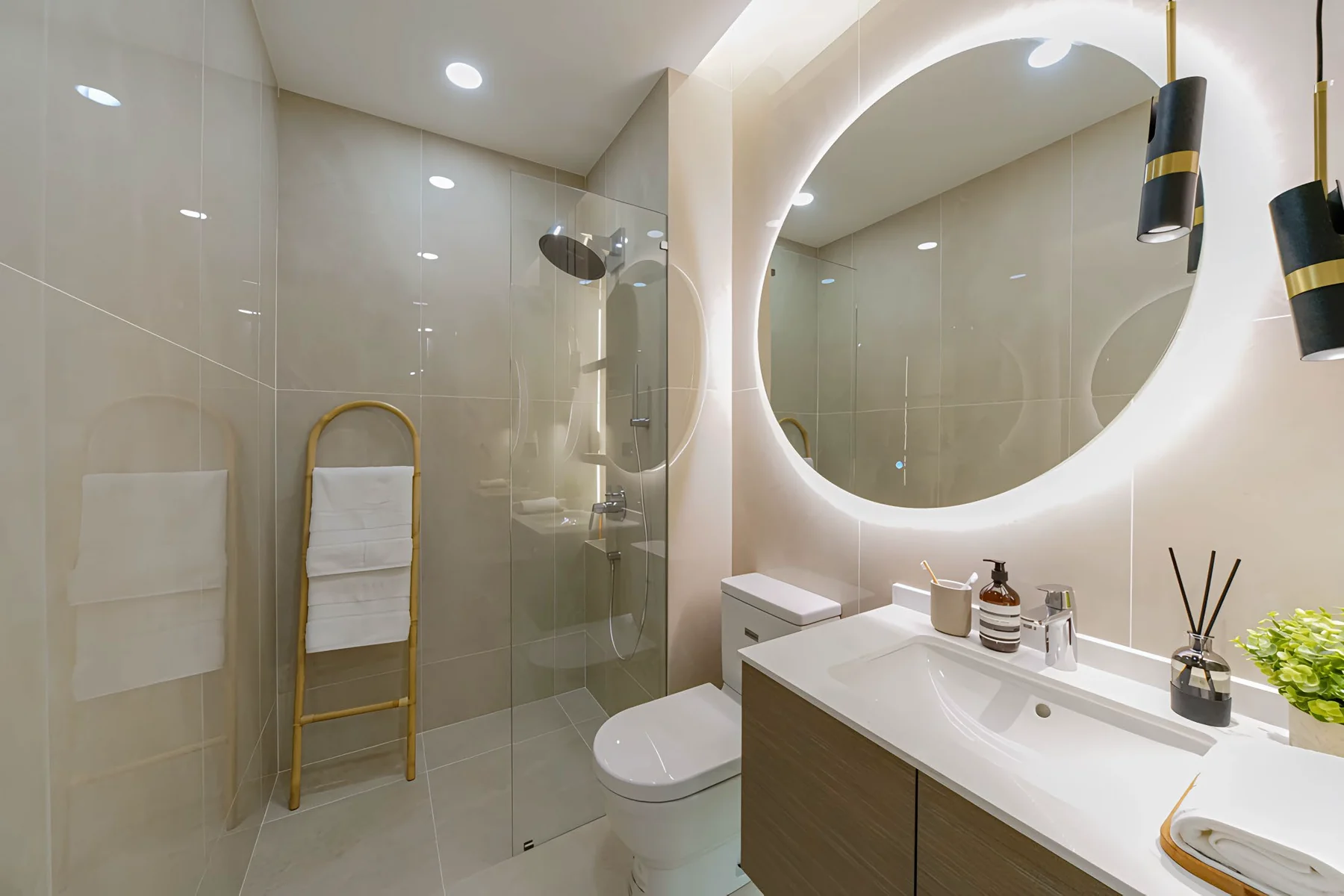 Centrix The Station KLCC show unit bathroom with a round lit mirror