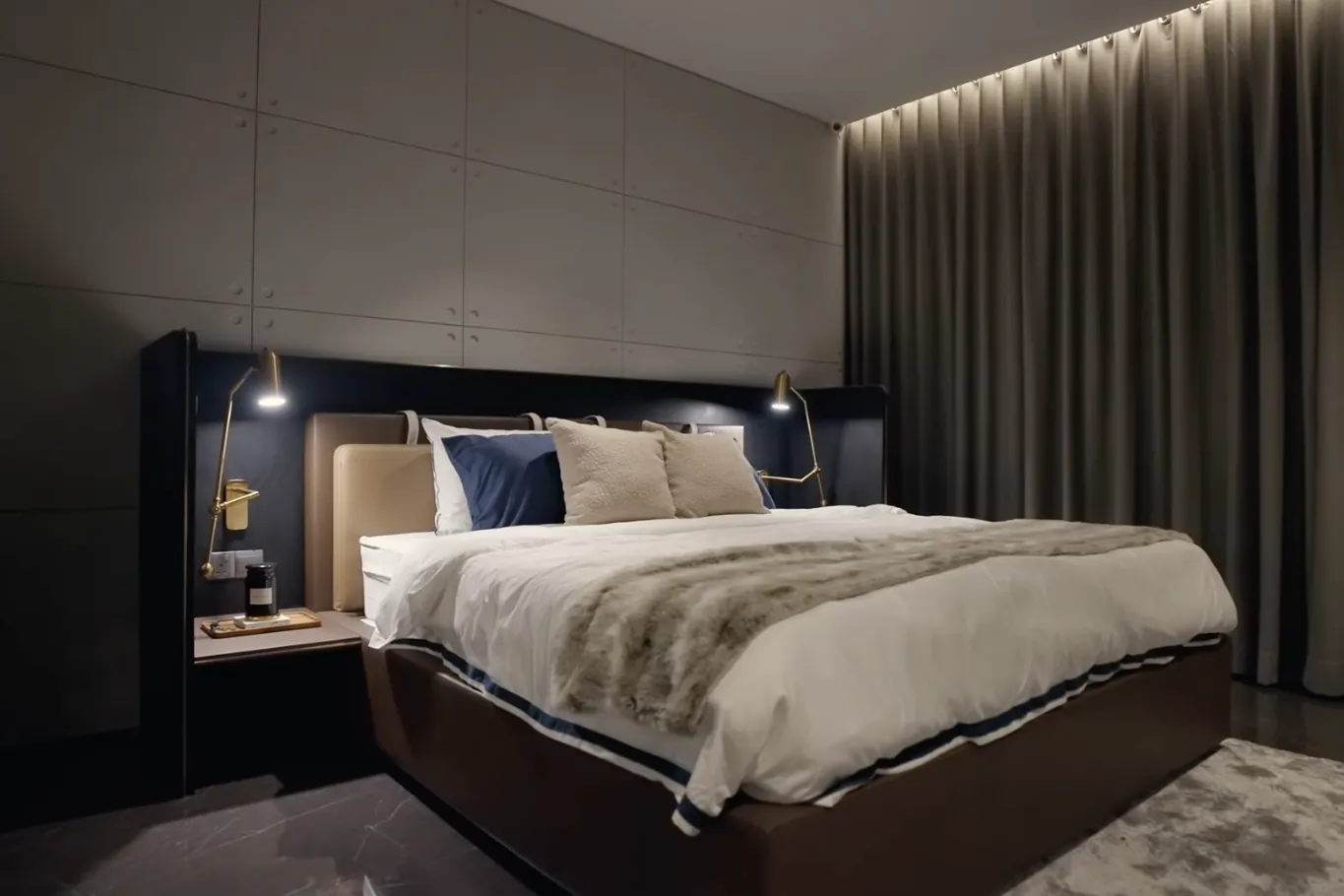 CloutHaus Residences show unit bedroom with full-height curtains