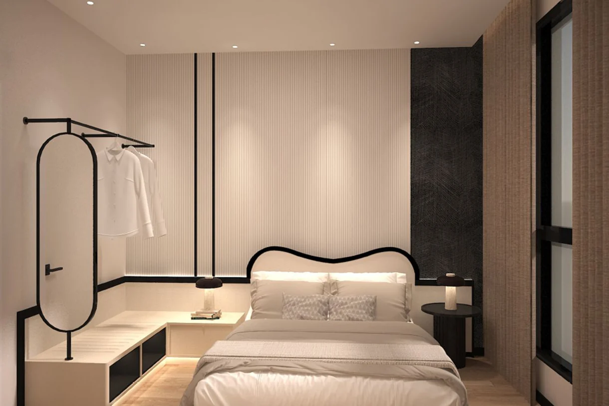 Bedroom with an open wardrobe rail in the black-and-ivory design concept for Phoeniz Suites