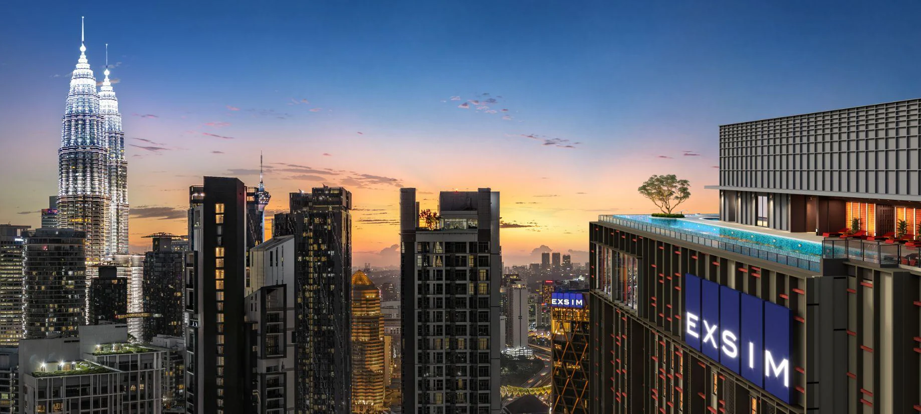 The rooftop pool of Phoeniz Suites with the Petronas Twin Towers at dusk