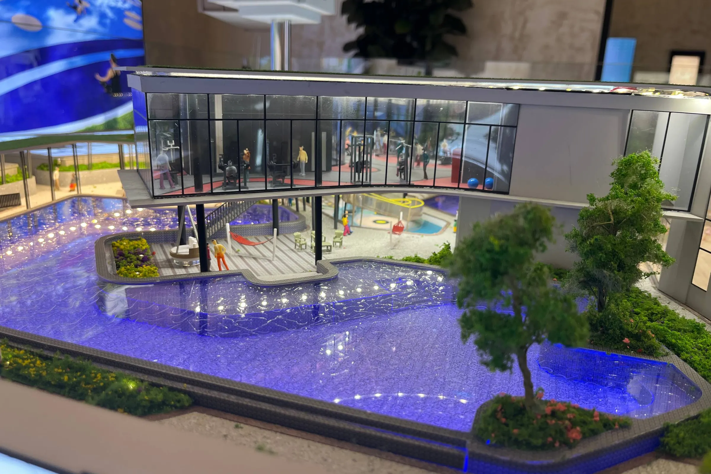 The scale model of The Queenswoodz podium pool and gym