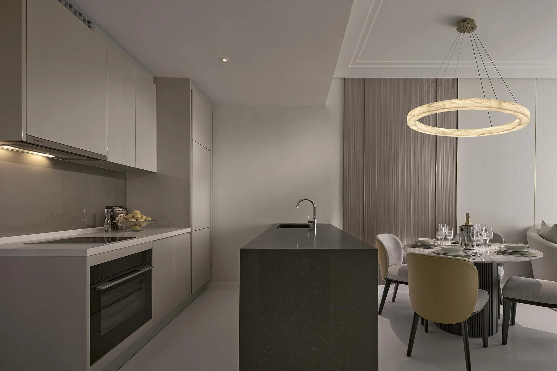 Royal Suites Damansara Heights Type J2 kitchen with an island beside the dining table