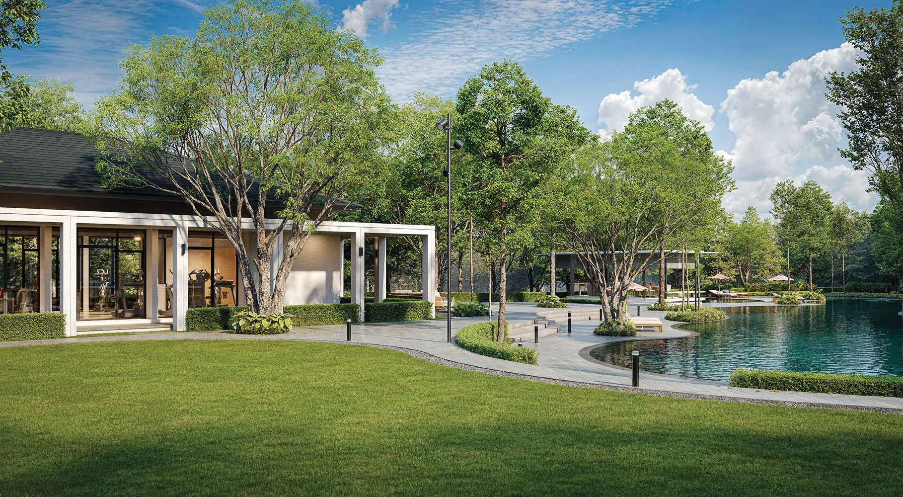 The Seri Embun clubhouse beside the water, with its lawn