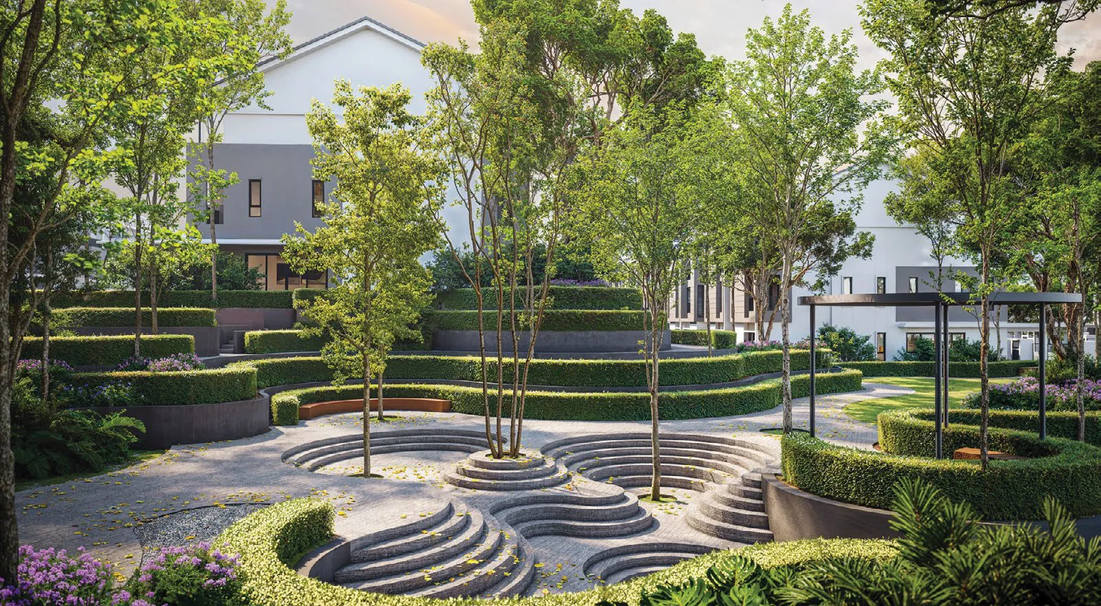 A curved stone garden with terraced hedges in the Seri Embun linear park