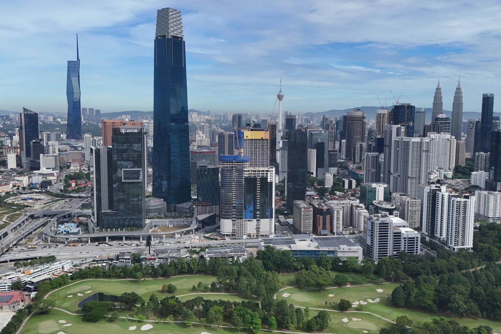 Kuala Lumpur city centre by day, with The Exchange 106, Merdeka 118, KL Tower and the Petronas Twin Towers