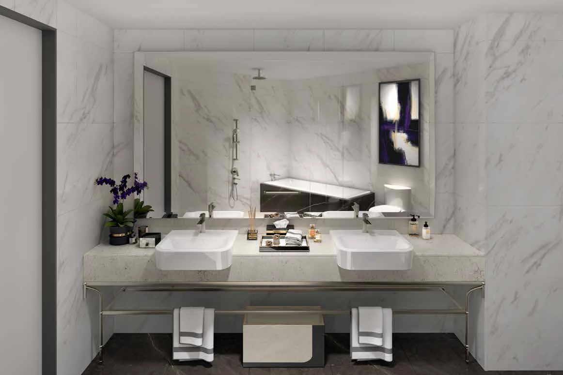 A marble bathroom with twin basins at SO/ Kuala Lumpur Residences