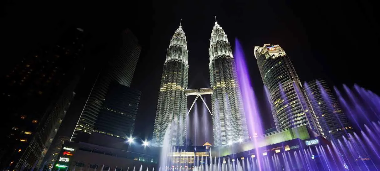 The Petronas Twin Towers lit up at night, 200 m from SO/ Kuala Lumpur
