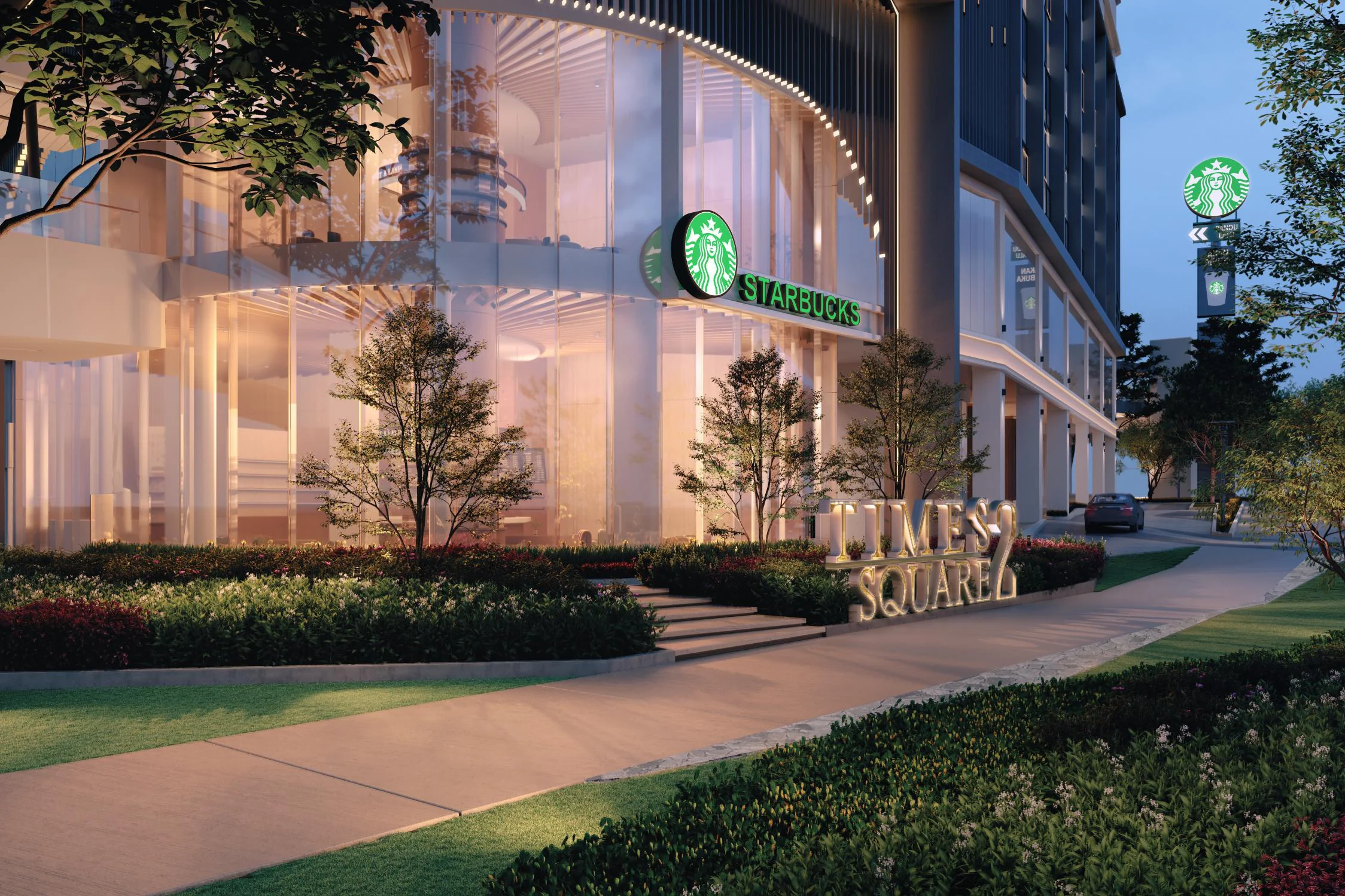 The tree-lined ground level of Times Square 2 with a drive-thru café