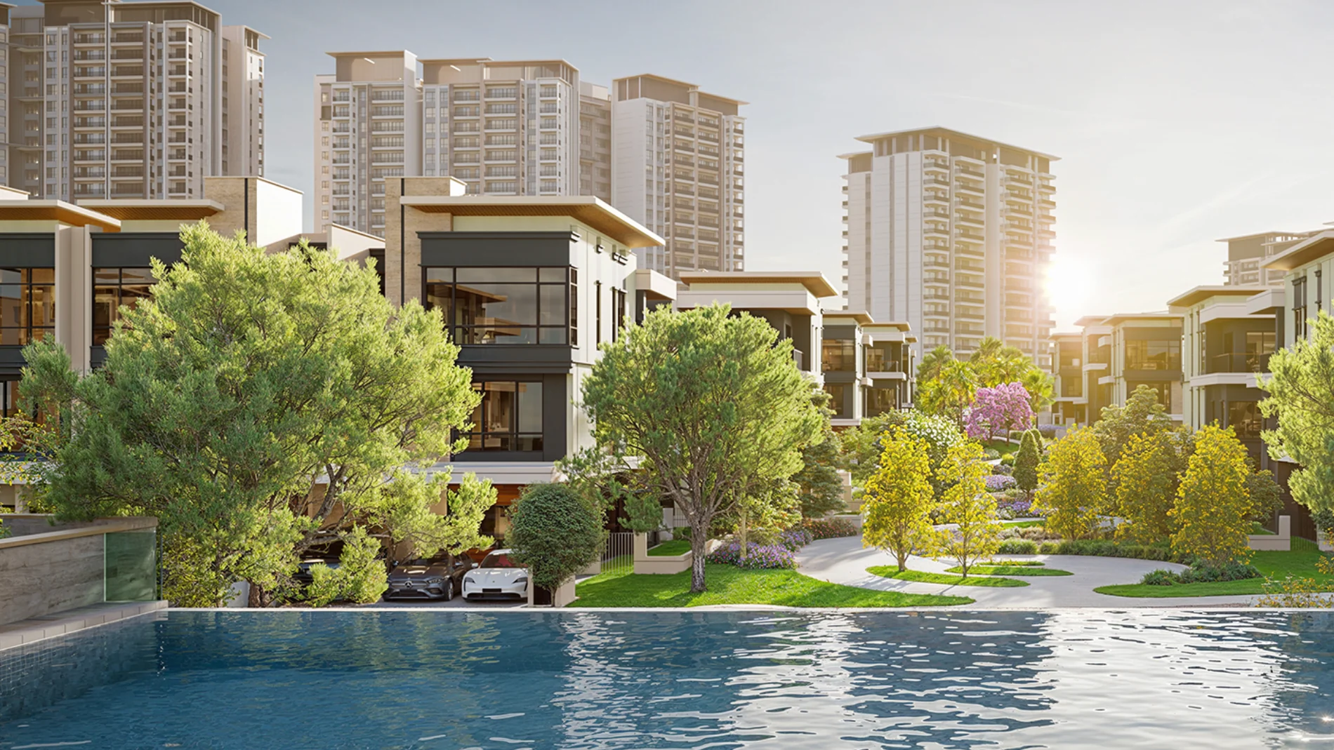 Zenia Parkhomes three-storey homes beside the pool at ParkCity Damansara, with the Condovillas behind